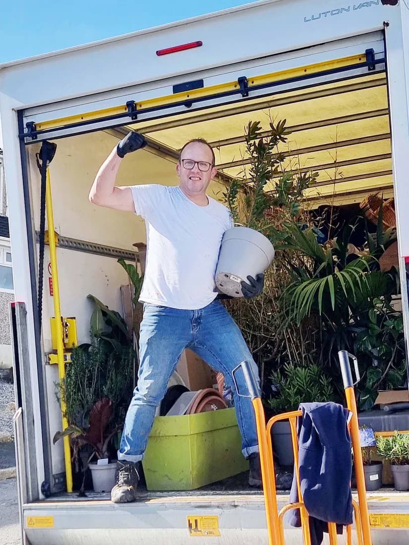 Eddy in the back of the loaded van mid-removal