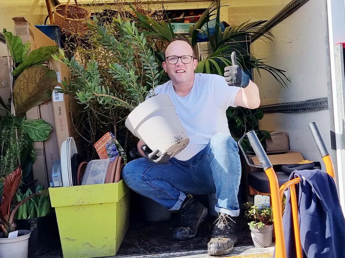 Eddy loading plants and garden items into the van on a house clearance